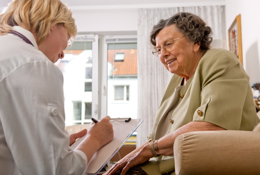 Doctor consulting with elderly woman